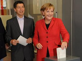 Joachim Sauer in Angela Merkel