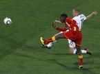 Asamoah Gyan in Jay DeMerit