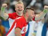 Sverre Jakobson in Robert Gunnarsson se veselita zgodovinskega uspeha islandskega rokometa. Foto: EPA