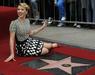 Prvo zvezdo na Pločniku slavnih, v izvirniku The Walk of Fame, je leta 1960 dobila igralka Joanne Woodward. Letos sta se svoje zvezde med drugim razveselili igralki Scarlett Johansson (na fotografiji) in Jennifer Aniston ter nekdanji član legendarne britanske skupine The Beatles Paul McCartney. Foto: EPA
