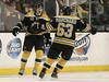 Torey Krug in Brad Marchand (Boston Bruins)