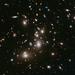 Novi posnetek Pandorine kopice. Hubble je zaslonko držal odprto okolo 67 ur, da je zajel potrebno količino svetlobe tudi najbolj oddaljenih zvezd. Modre galaksije so oddaljene 8 milijard svetlobnih let in več. Foto: NASA/ESA/STScI