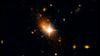 Galaksija in opazovani kvazar 3C186 sta osem milijard svetlobnih let stran. Foto: NASA, ESA, M. Chiaberge (STScI and JHU)