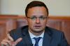 Madžarski zunanji minister Szijjarto je dejal, da na Madžarskem ne verjamejo, da je dogovor pravno nezavezujoč. Foto: Reuters