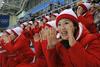 Severni Korejci na olimpijskih igrah skrbijo za popolno medijsko podobo, s katero skušajo izboljšati svoj sloves v mednarodni skupnosti. Foto: Reuters