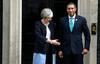 Theresa May in Andrew Holness