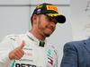 Lewis Hamilton je v Sočiju dosegel 70. zmago v formuli ena. Več jih ima le legendarni Michael Schumacher (91). Zmage se Britanec ni pretirano veselil. Foto: Reuters