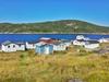 Domovanja, ki stojijo danes na Fair Islandu, so skoraj vsa zgrajena po letu 1961 kot počitniške hiške. Foto: MMC RTV SLO/Kaja Sajovic