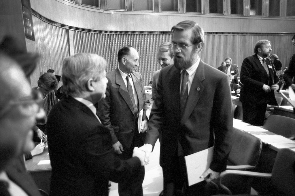 After the vote on the plebiscite law in the Assembly, handshake between Prime Minister Lojze Peterle and Prime Minister Milan Kučan, Ljubljana, 6 December 1990. Photo: Nace Bizilj / preserved by the Museum of Recent History of Slovenia